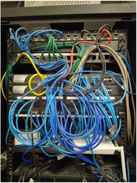 Cabinet before reset: unlabelled tangled patch leads