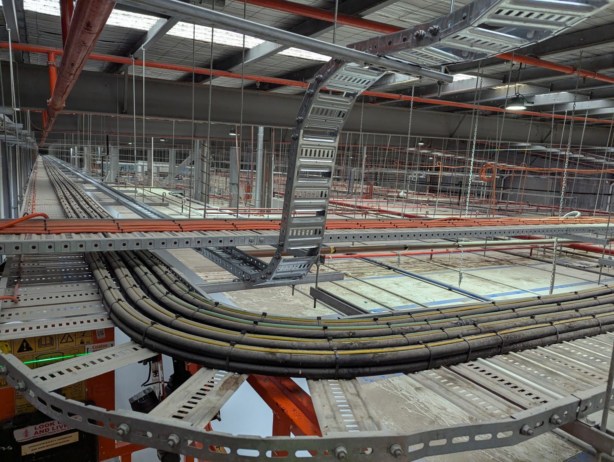 Industrial cable tray installation in manufacturing plant