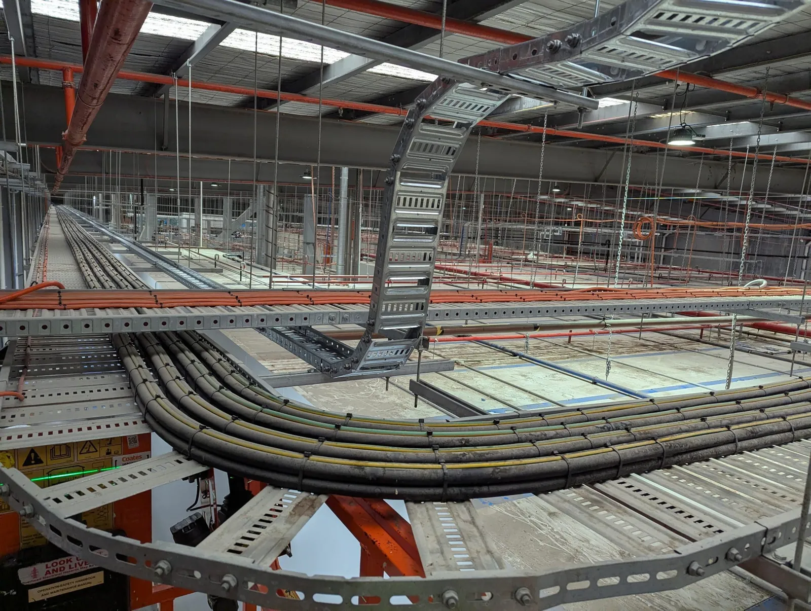 Industrial cable tray installation in manufacturing plant