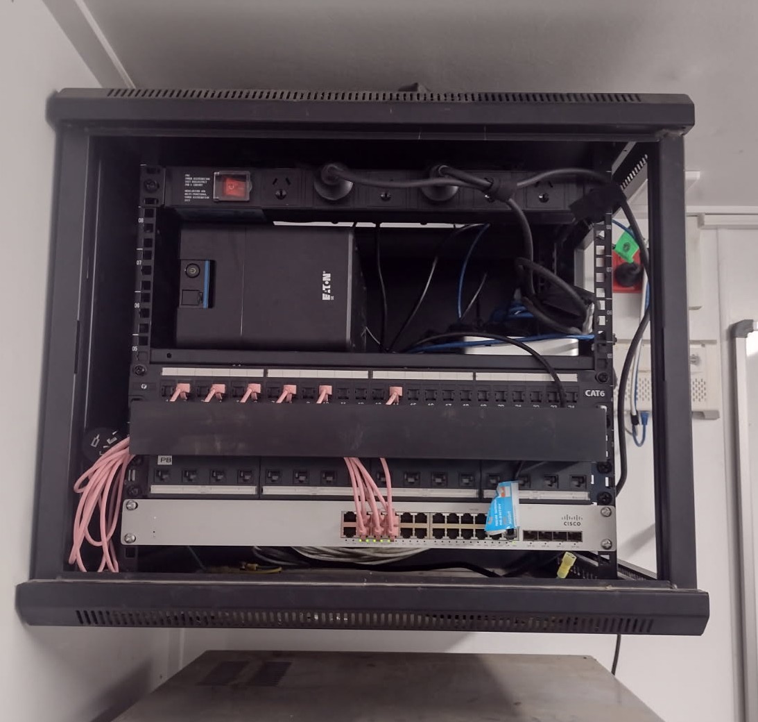 PLACEHOLDER IMAGE — general warehouse network infrastructure photo, not an actual office move in progress. To be swapped once dedicated relocation photography exists.