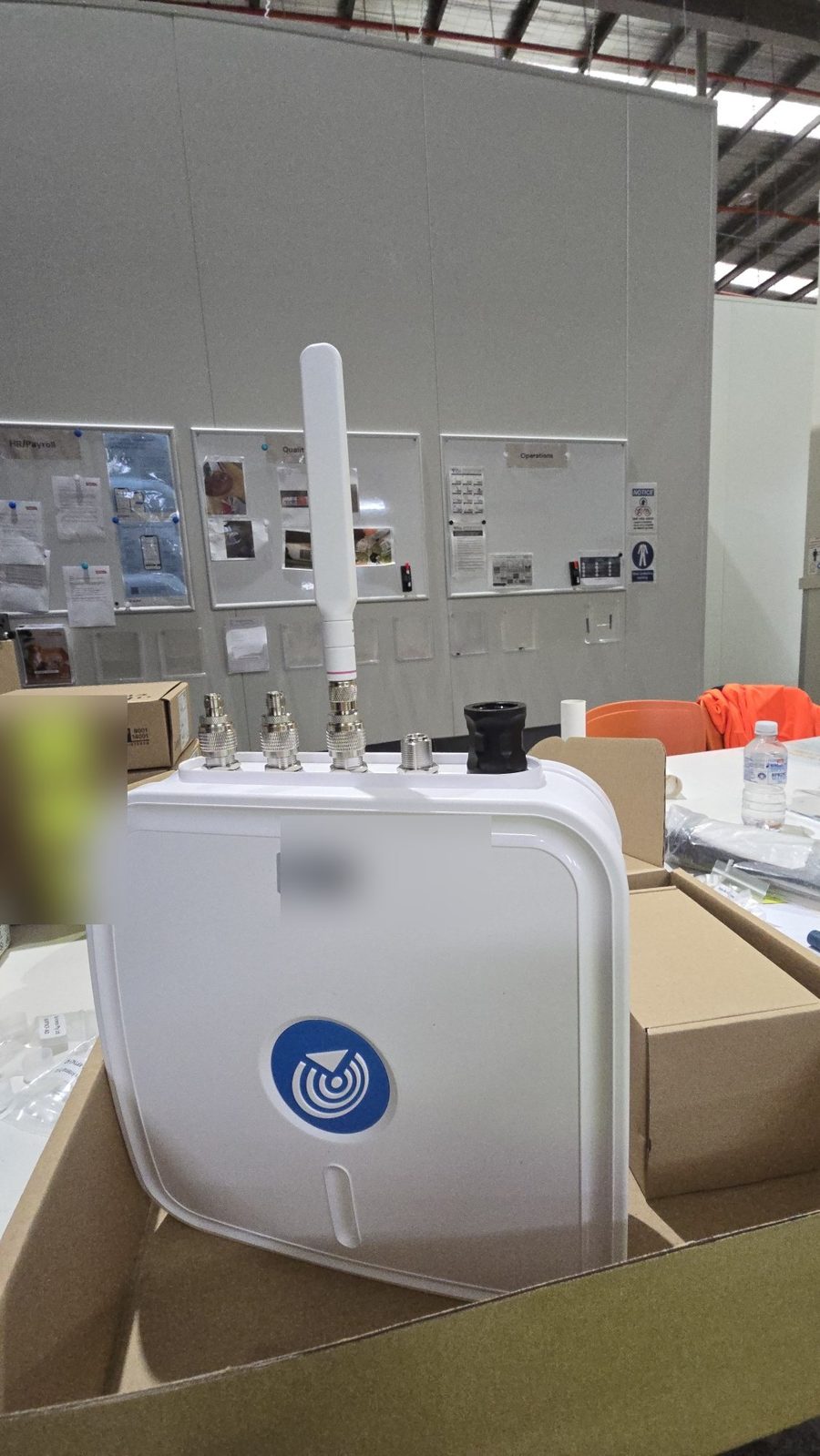Completed NEMA enclosure with antenna installed via RF adaptors on an industrial site