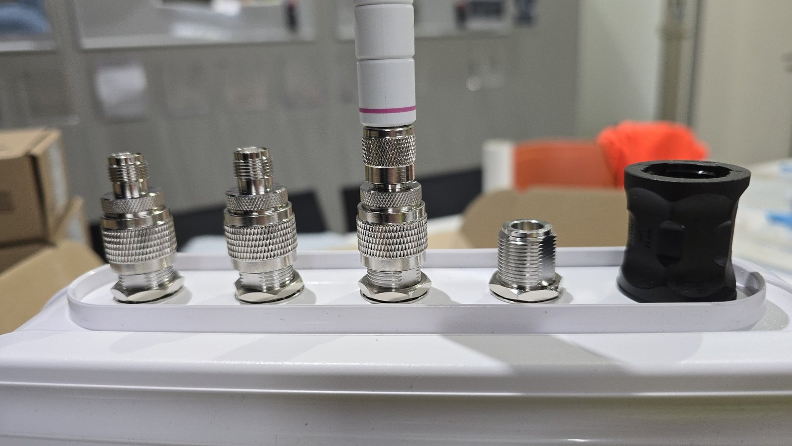 N Female to RP-TNC Male adaptors fitted to NEMA enclosure bulkhead ports with antenna mated