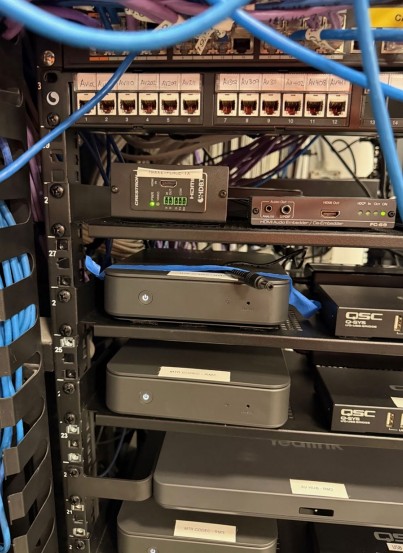 AV rack commissioned — QSC amps, Logitech systems, patch panel, data cabling
