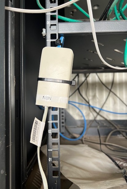 NBN device in rack — Sydney warehouse, carrier integration and service restoration