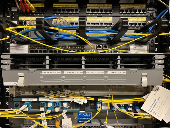 Peak fibre FOBOT enclosures FE FF FG FH — labelled and racked, Sydney data centre